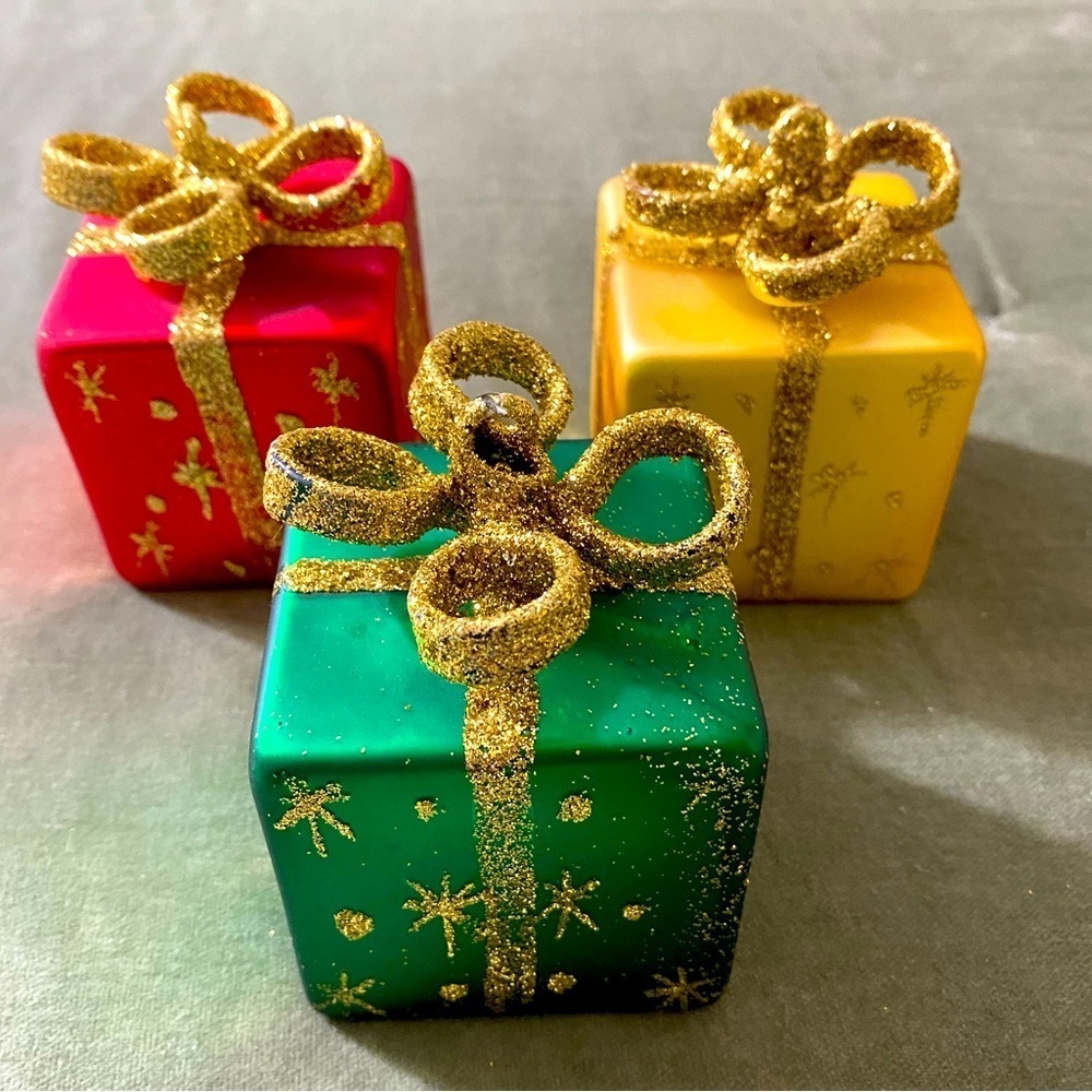 Vintage glass ornaments wrapped presents with gold bows. OSCH